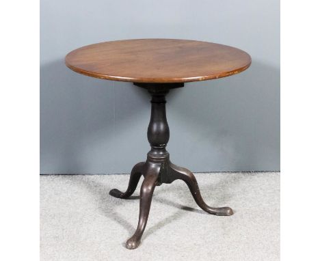 A George III mahogany circular tripod occasional table on baluster turned central column and cabriole legs with pad feet, 30i