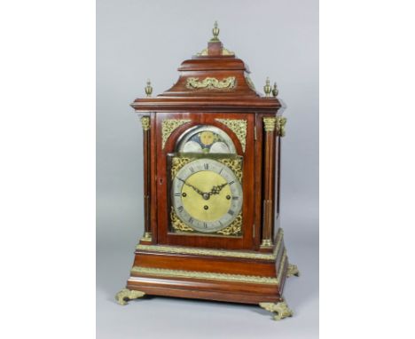 A late 19th Century mahogany cased mantel clock in the 18th Century style, the 7.5ins arched brass dial with narrow silver ch