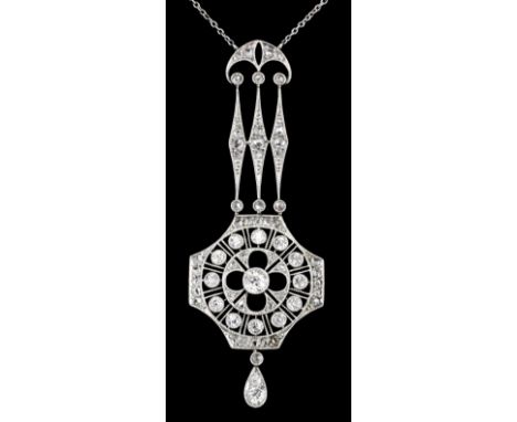 An Edwardian silvery coloured metal mounted all diamond set pendant the elongated pierced panel set with fifty small old cut 