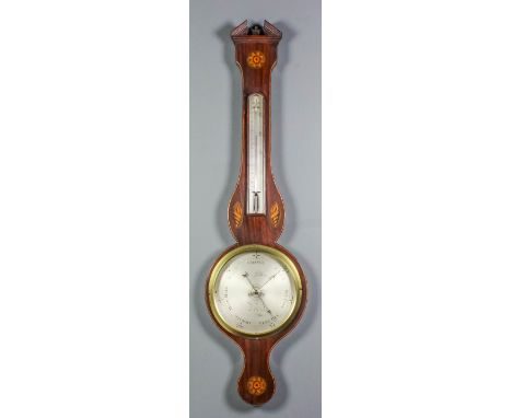 A late George III mahogany wheel barometer and thermometer by James Lillia, with 8ins diameter silvered dial and alcohol ther