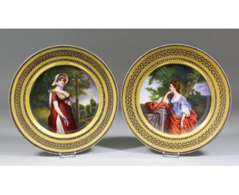 A pair of late 19th Century "Vienna" porcelain cabinet plates, each painted to the centre with a three quarters length portra