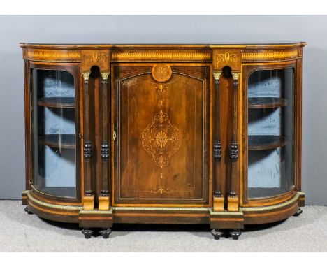 A late Victorian rosewood and gilt metal mounted credenza with curved ends, the frieze inlaid with stylised leaf banding and 