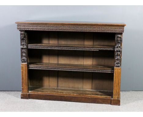 A Victorian oak open front bookcase with moulded edge to top and leaf carved frieze, fitted two open shelves, the sides carve