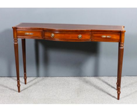 A modern mahogany bow and break-front side table of Georgian design by Arthur Brett & Sons, the top crossbanded in satinwood,