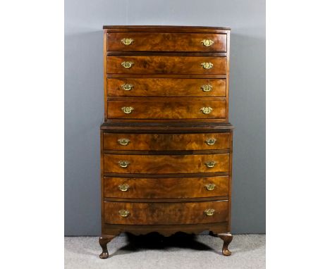 An early 20th Century mahogany and burr walnut bow-front tallboy of 18th Century design, with reeded edge to upper and lower 