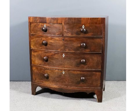 A late Georgian mahogany bow-front chest with square edge to top, fitted two short and three long drawers, on shaped apron an