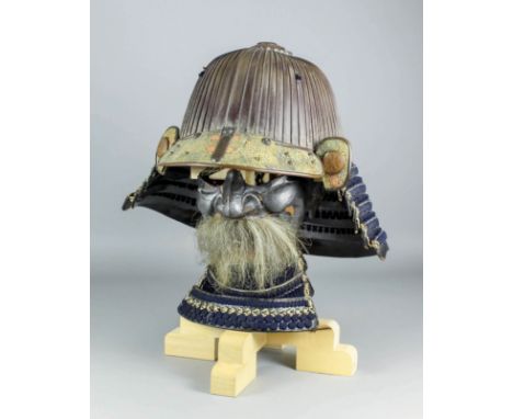 A good 18th Century Japanese Suji Kabuto Samurai helmet in russet iron, maebashi inlaid with decoration, with matching mempo,