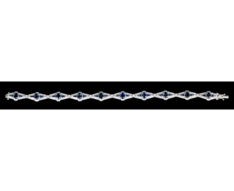 A modern 18ct white gold sapphire and diamond set cocktail bracelet, the ten marquise pattern panels each set to the centre w