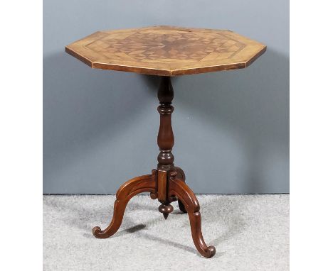 A Victorian walnut octagonal tripod occasional table with parquetry top, on turned central column and scroll legs, 24ins diam