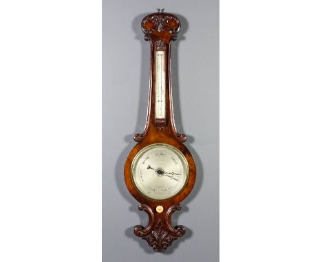 A Victorian walnut cased wheel barometer and thermometer by E.G. Wood, 74 Cheapside, London, with 8ins diameter silvered dial