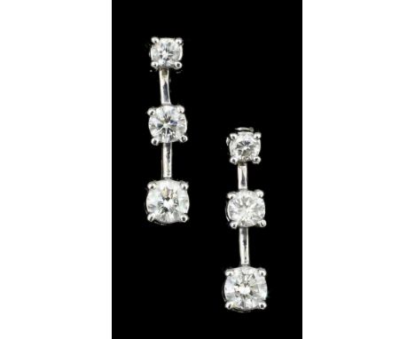 A pair of modern 18ct white gold all diamond set pendant drop earrings (for pierced ears), the brilliant cut stones graduatin