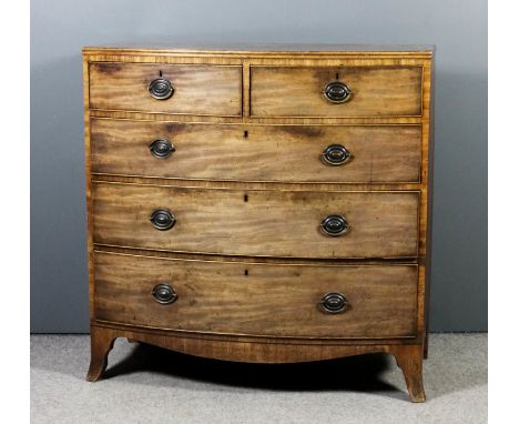 A late Georgian mahogany bow-front chest with twin reeded edge to top, fitted two short and three long drawers, on shaped apr