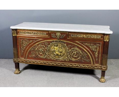 A modern French mahogany and gilt brass mounted commode of Louis XVI design, with white flecked marble slab to top with shape