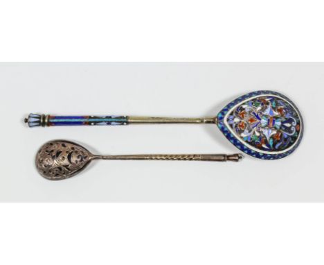 A Russian silvery metal and champleve enamel spoon, the bowl enamelled with scroll and leaf ornament, and with enamelled term