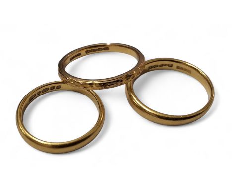 A 22ct gold half barrel band, size M, Fetter, Forbes &amp; Co, Birmingham, 1928, 3.8g; another, size K, SH, Birmingham, 1955-