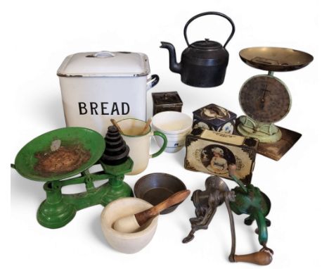 An early 20th century white enamelled bread bin and cover;&nbsp; a set of scales adn weights;&nbsp; a mincer;&nbsp; pestle an
