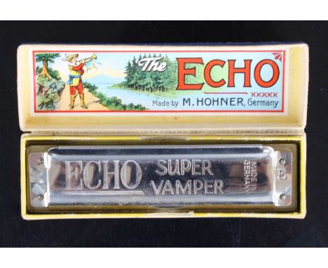 An M. Hohner The Echo Super Vamper harmonica, in original box, together with three M. Hohner Echo Vamper harmonicas, boxed. (