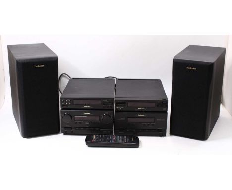 A Technics separates stereo system, components to include a stereo synthesizer tuner, ST-CH7L, a stereo integrated amplifier 
