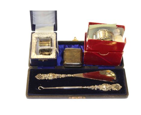 Two silver napkin rings, silver vesta and silver-handled button hook and shoe horn