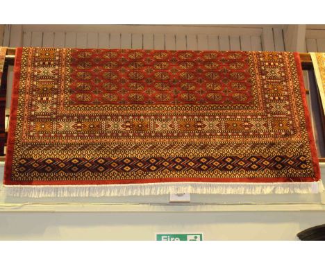 Bokhara carpet with a red ground 2.80 x 2.00