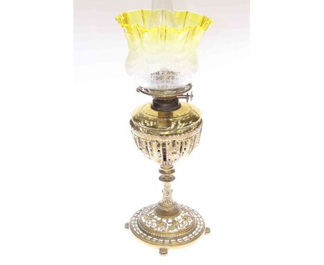 Pierced brass column oil lamp with green glass reservoir and etched shade