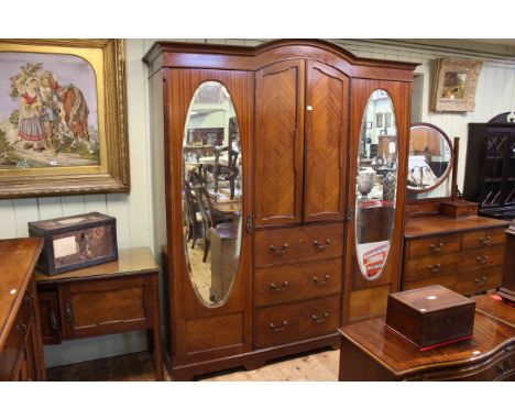 Edwardian mahogany three piece bedroom suite comprising combination double mirror door wardrobe, dressing table and two door 