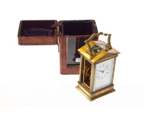 French brass carriage clock, retailed by Crichton, Edinburgh, in a travelling case, (lacking a side panel)