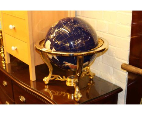 Semi-precious stone celestial globe on blue ground