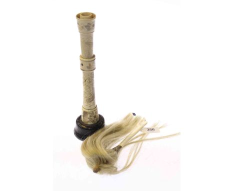 Bone-handled duster and a Chinese engraved bone candlestick (2)
