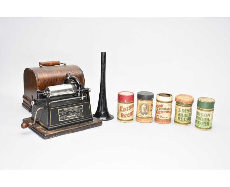 A cased Edison GEM phonograph wax cylinder player with a collection of eleven wax cylinders.