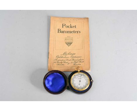 A gilt brass pocket aneroid barometer, with unsigned silvered dial, in a leather cassy case, 5cm dia.