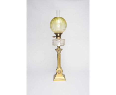 A Victorian brass Corinthian column oil lamp, with etched vaseline glass globe and plain chimney above a facet-cut glass rese