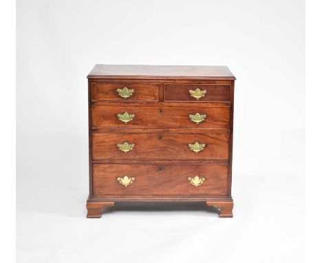 A George III mahogany, crossbanded chest of drawers, the moulded rectangular top crossbanded, over two short and three long, 