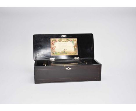 An inlaid and parcel ebonised rosewood Swiss cylinder music box,  of rectangular outline, the hinged lid inlaid with a marque
