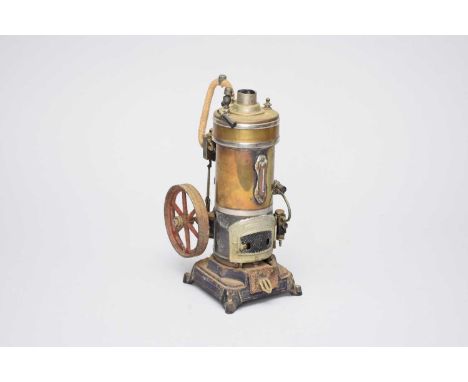 A scale model static vertical cylinder steam engine, maker unknown, the brass cylinder on a cast iron base with removable bur