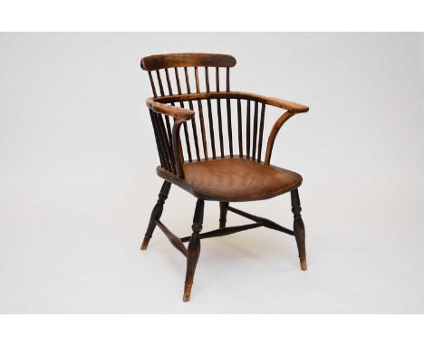 A 19th century elm and beech comb-back type windsor armchair with eliptical turned legs united by an 'H' stretcherCondition r