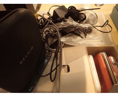 Three mobile phones and digital camera all Samsung and Belkin wireless router and selection of charging plugs and leads 