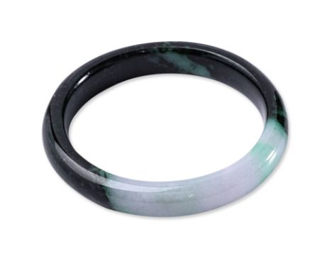 A TYPE A JADEITE BANGLE Featuring a dark green jadeite bangle with near colourless and green patches. Accompanied with Nan Ya