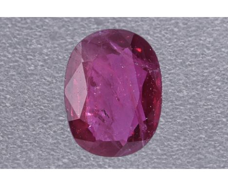 A LOOSE RUBY GEMSTONE Featuring an oval cut ruby weighing approximately 1.28 Cts, slight inclusions. Accompanied with Nan Yan