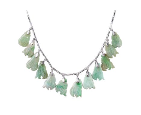 A JADE NECKLACE
Featuring twelve carved jade each carved as 'buddha's hand fruit', mounted to a white gold setting marked '75