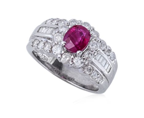 A RUBY AND DIAMOND RING Featuring an oval cut ruby weighing approximately 1.08 Cts (marked), mounted in a platinum setting ma