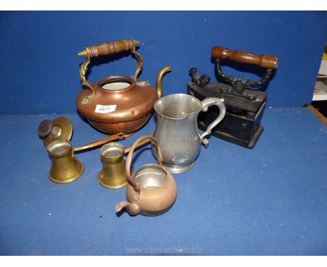 A copper teapot (lid missing), two brass measures, an antique cast clothes iron, door stop, pewter tankard, etc.