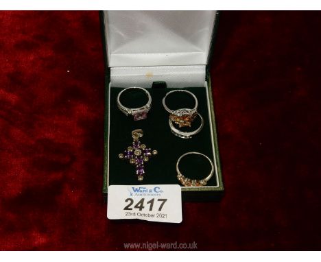 Three 925 Sterling Silver dress rings, white metal ring and an Amethyst pendant.