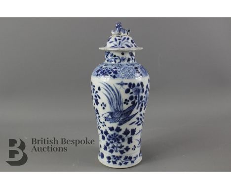 Chinese 19th Century blue and white vase, painted with flowers and birds, foo dog finial, approx 24 cms h, character marks to