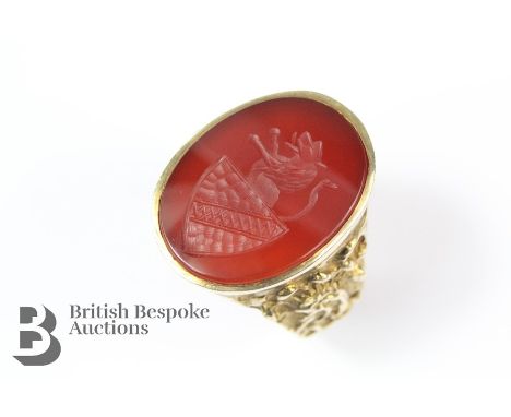 9ct yellow gold armorial carnelian seal ring, the oval-cut seal depicting a lion and shield, approx 20 x 15 mm, size S, Londo