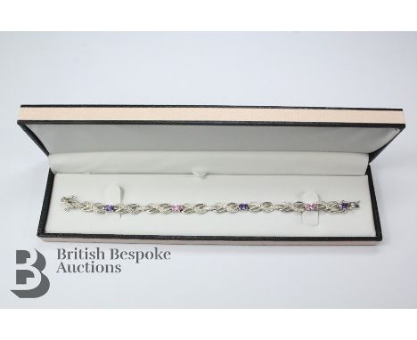 925 silver and amethyst line bracelet, set with three oval amethysts approx 6 x 4mm approx 18 cms l, approx 14 gms.&nbsp;