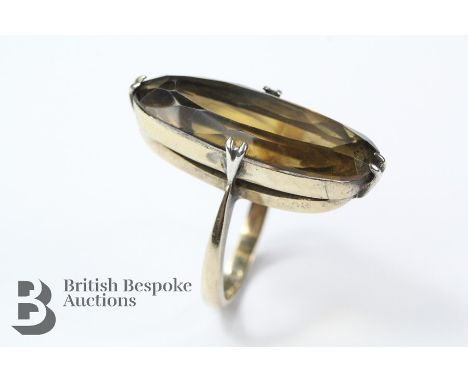 9ct yellow gold baguette-cut smoky quartz ring, the stone measures approx 30 x 10 mm, size N, stamped 9ct, approx 6.12 gms.&n