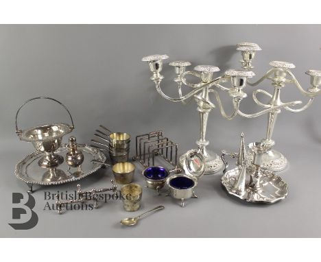 A collection of silver plate including; chamber light and two snuffers, card tray, two candelabras (af), knife rests, toast r