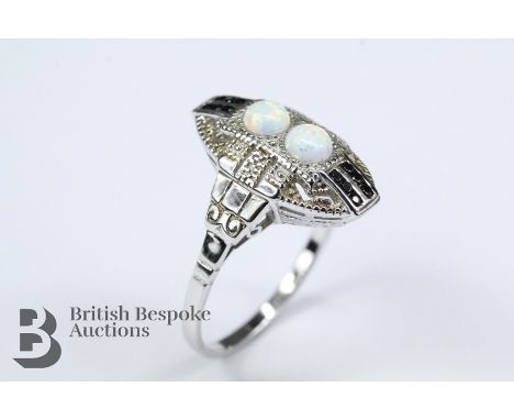 Silver ring, set with opal panels heightened with sapphires, size P, approx 3.26 gms.