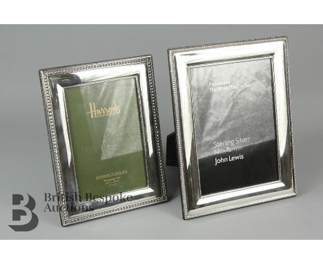 Two silver photo frames, the first being a Harrods example approx 15 x 10cms, the other being a John Lewis example approx 13 
